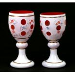 A pair of Bohemian overlaid glass goblets, the largest 19cms high (2).