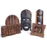 An African carved wooden fertility mask, 37cms high; together with a Delft windmill, a carved wooden
