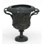 After the antique, a bronze urn in the Grand Tour style cast with Bacchanalian scenes and