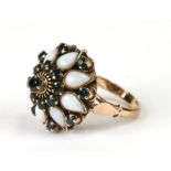 An 18ct gold hareem ring set with sapphires and opals, total weight 6.3g, approx UK size 'O'.