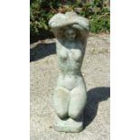 A reconstituted stone statue in the form of a kneeling lady, 48cms high.
