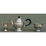 A late Victorian matched silver three-piece tea set, Sheffield 1897, 1898 and 1899, comprising a