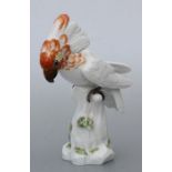 A Meissen figure of a cockatoo standing on a tree stump, 25cms high.Condition ReportMissing one