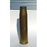 A large brass shell case, 68cms high.
