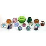 A Victorian glass dump, 9cms high; together with other paperweights and dumps (15).