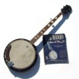 An Ozark Remo banjo and 'How to Play the Banjo' booklet.