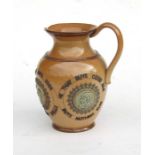 A Doulton Lambeth stoneware motto jug 'He That Buys Good Ale Buys Nothing Else' 19cms high.Condition