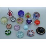 A quantity of Art glass paperweights to include a Murrina millefiori example and two Caithness