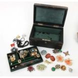 A Victorian leather jewellery box containing costume jewellery.