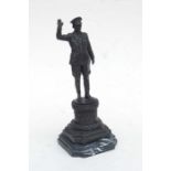 A bronze figure of the Führer Adolf Hitler taking a salute, on a marble plinth, 36cms high.