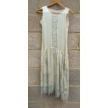 A 1920's flapper girl beadwork wedding dress; together with other textiles.Condition ReportBoth