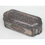 A white metal / silver plated Indian box highly decorated with foliate scrolls, 14.5cms wide.
