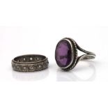 A silver and amethyst dress ring, approx UK size 'S'; together with a bi-metal eternity ring, approx