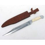 A large Bowie Knife with bone handle in its leather scabbard. Blade length 26cms (10.25ins) with