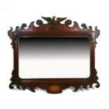 A George III style mahogany fretwork wall mirror with eagle finial, 94cms wide.