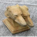 A reconstituted sandstone effect pair of greyhound / lurcher heads. 46cm long