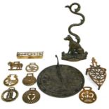 A brass sun dial, 25cms diameter; together with a brass door stop in the form of a seated hound;