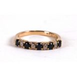 A 9ct gold diamond and sapphire half hoop eternity ring, weight 2g, approx UK size 'L'.