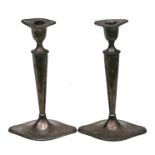 A pair of Adams style silver candlesticks with navette form bases and sconces, London 1909, 23cms