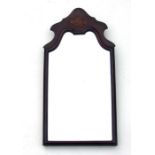 A Georgian style mahogany wall mirror. 31 by 61cm