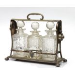 A silver plated three-bottle tantalus, 30cms high.Condition ReportSilver plate is worn and central
