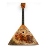 An early 20th century Russian Balalaika decorated with a winter landscape scene with a two-horse