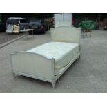 A French Empire style single bed with painted head and foot boards, 116cms wide.