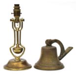 A brass table lamp with gimble column; together with a brass bell (2).