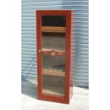 A large shop display humidor with glazed panelled door enclosing a shelved interior, 150cms high