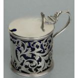 A Victorian pierced silver mustard pot with blue glass liner, Birmingham 1876, silver weight 90g,