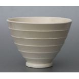 A Wedgwood Keith Murray white glazed tapering vase, 19cms diameter.Condition ReportStained to the