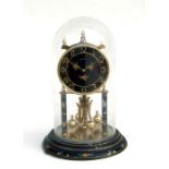 A 330-day Anniversary clock under a glass dome, 30cms high.