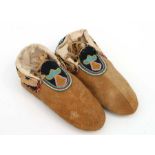 A pair of North American native Indian leather moccasins with bead work decoration, approx 27cms