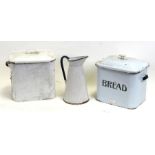 A 1950s vintage white and black enamel lidded bread bin, 33cms wide; together with another similar