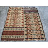 A pair of North American Native Indian flatweave rugs or throws with repeating geometric patterns,