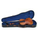 A German violin with a 13.5ins two-piece back, bears paper label 'Antonius Stradivarius', cased.