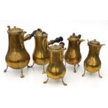 Five Regency style brass chocolate pots with treen handles, the largest 26cms high (5).