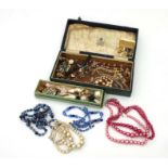 A quantity of costume jewellery to include necklaces and hat pins.