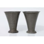 A pair of 17th century style pewter tapering vases with crown & moon wriggle work decoration,