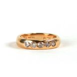 An 18ct gold and five-stone diamond gypsy style ring, weight 4.4g, approx UK size 'M'.