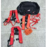 A Crewsaver Crewfit life jacket; together with similar life jackets in a Musto Yachting holdall.