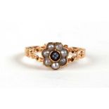 A yellow metal (tests as 18ct) pearl and hardstone cluster ring, approx UK size 'Q'.