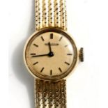 A ladies Jaeger Le Coutre 18ct gold bracelet watch, the champagne dial with baton indices, signed '