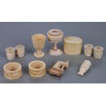 A 19th century ivory sewing accessories to include Chinese cotton winders, napkin rings and sewing