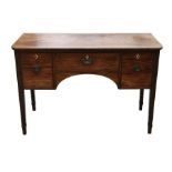 A 19th century mahogany sideboard of small proportions with central drawer flanked by two deep