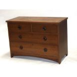 An Arts & Crafts oak chest with two short and three graduated long drawers, 107cms wide.