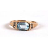 A 9ct gold ring set with a rectangular aquamarine and diamond set shoulders, weight 2.2g, approx