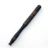 A Victorian painted treen truncheon with the remains of the VR cypher, 40cms long.