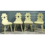 A set of four Austrian (Tyrolian) painted wooden chairs with shaped backs, solid seats and chamfered