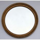 A gilt framed circular bevel edged wall mirror, 42cms diameter.